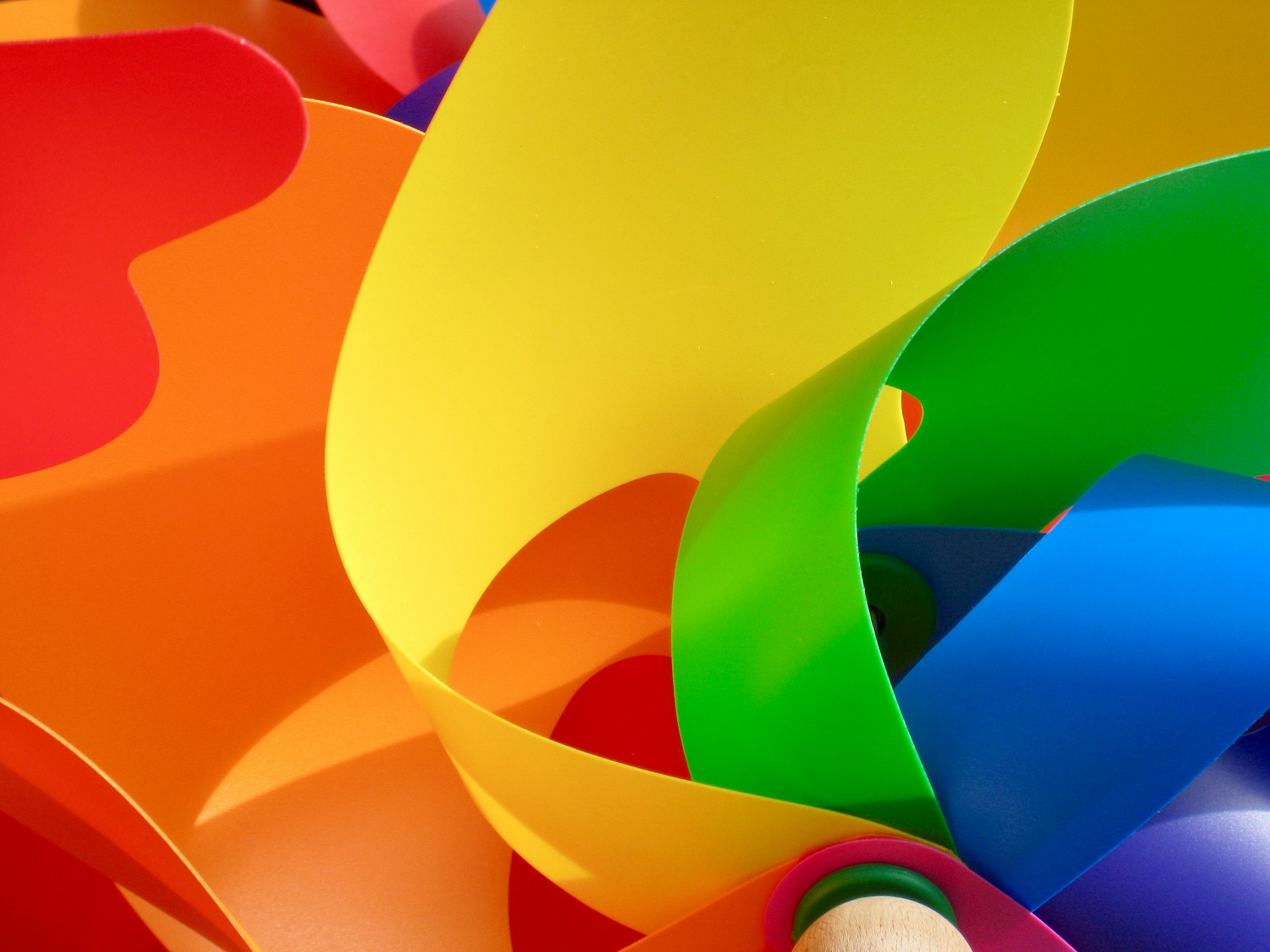 a bunch of different colored paper with a pencil in it